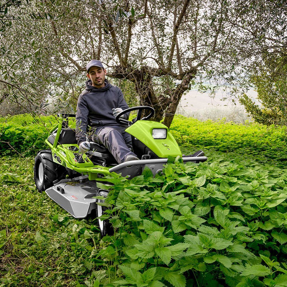 Man Riding A Lawn Mover And Cutting The Grass — The Saw Spot In Kyogle NSW
