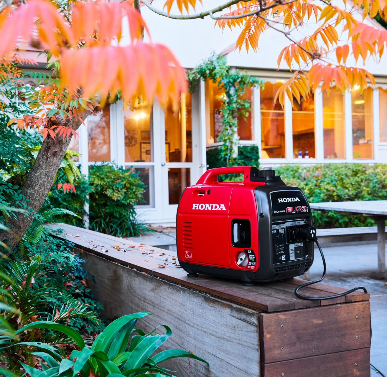 Man's Hand Holding A Damaged Lawn Mower Wheel — The Saw Spot In Kyogle NSW