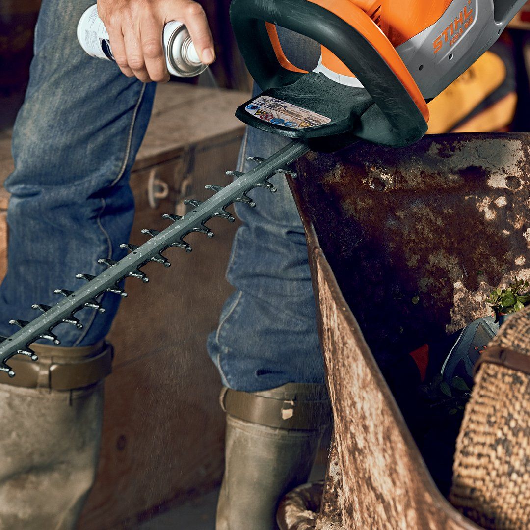 Man Repairing A Mower In A Workshop — The Saw Spot In Kyogle NSW
