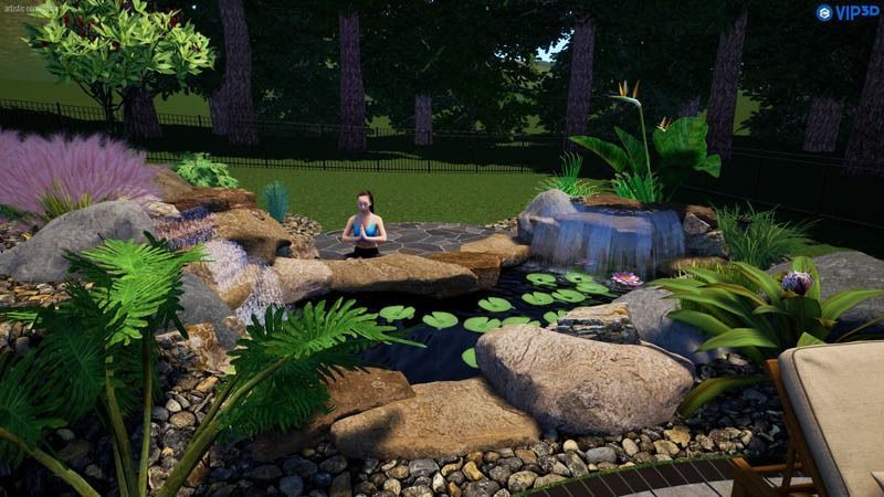 A person meditating near a pond with rocks, plants, and lily pads in a garden.