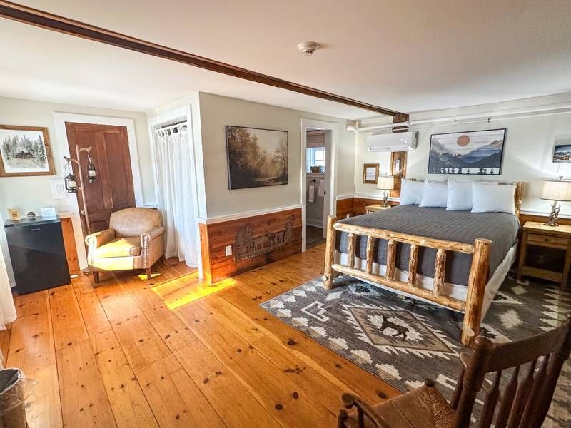 There is a large bed in the middle of the room.