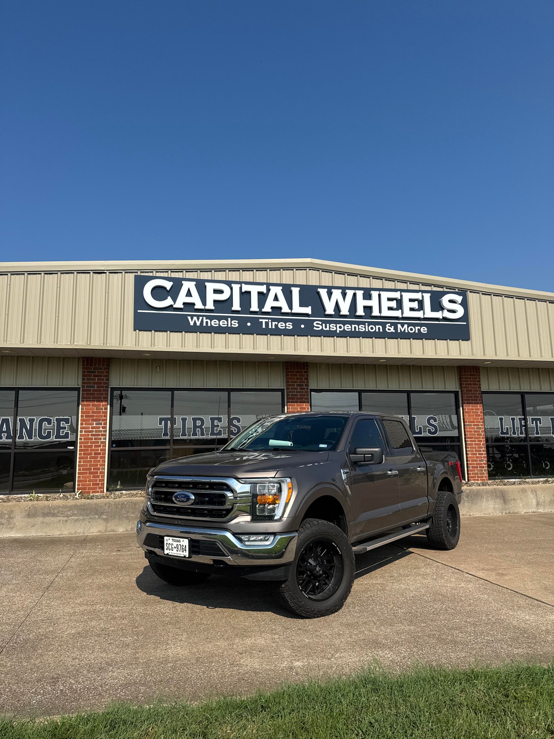 Brown Ford F-150 truck in front of 