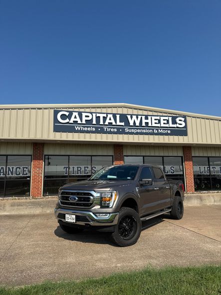 Brown Ford F-150 truck in front of