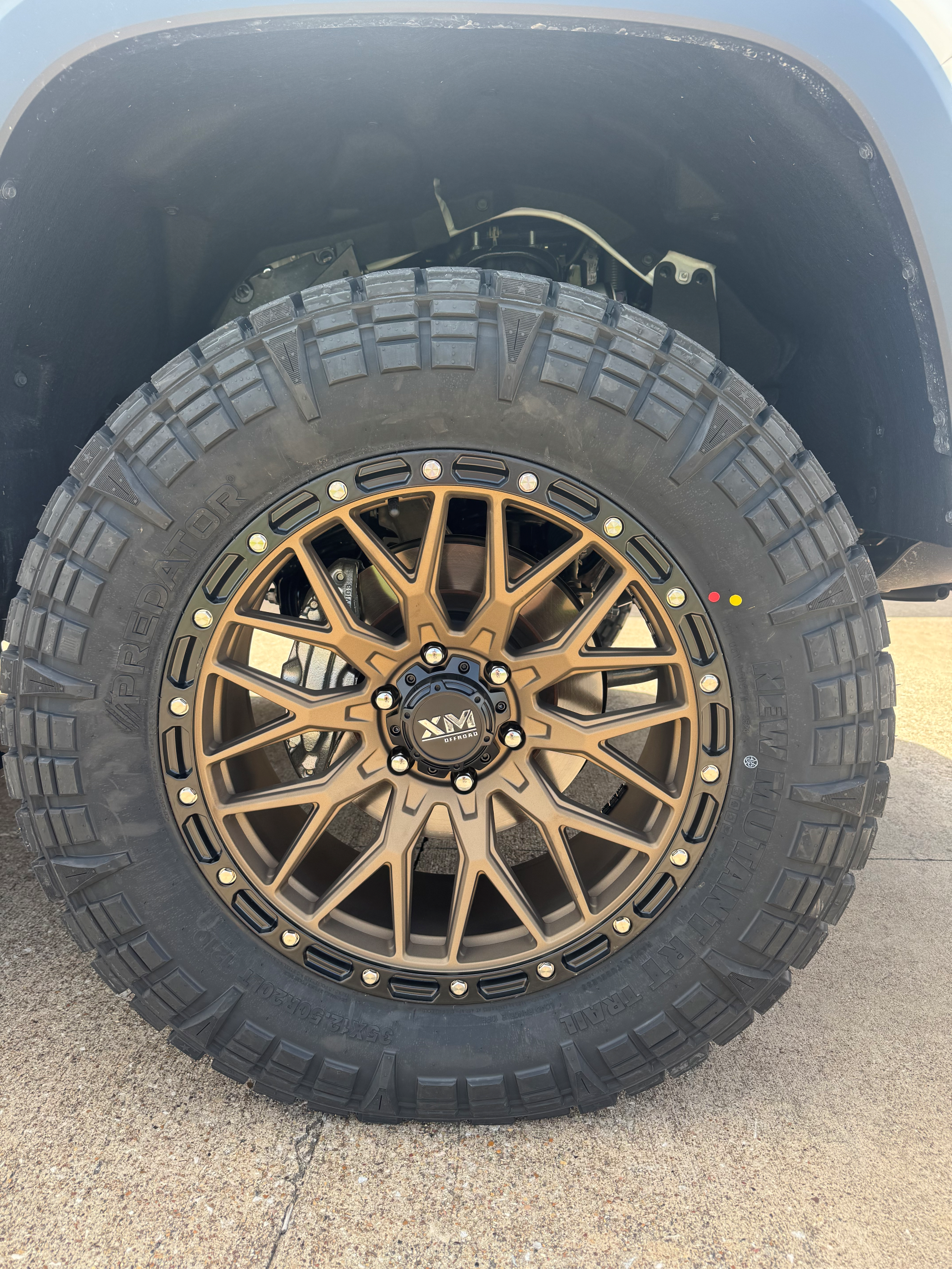 A close up of a tire and wheel on a truck.