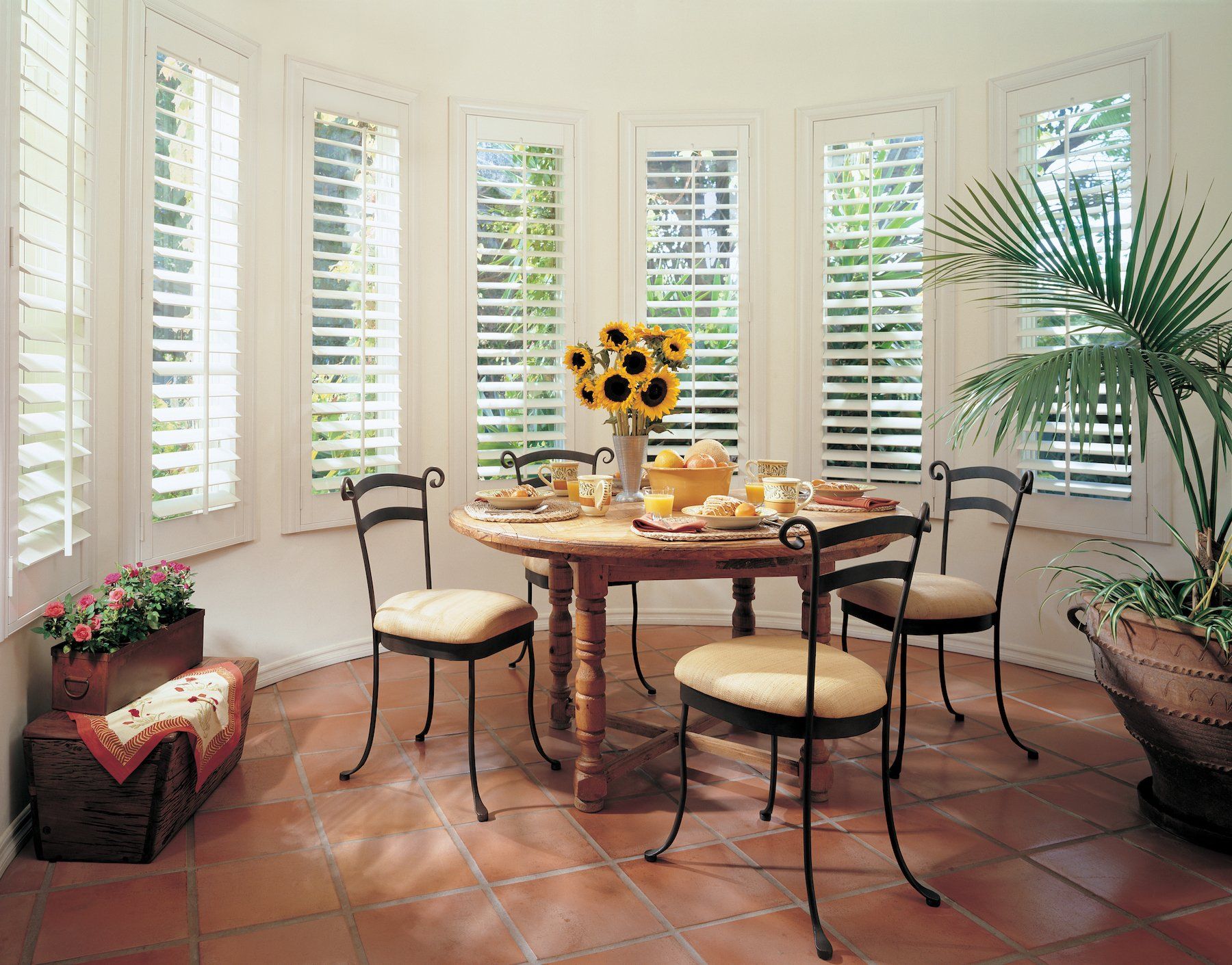 Sunny breakfast nook in San Juan, WA with wooden shutters