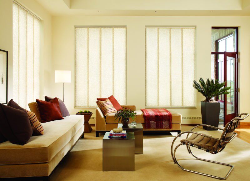 Living room with Hunter Douglas Skyline® Gliding Window Panels in Kent, WA vertical blinds