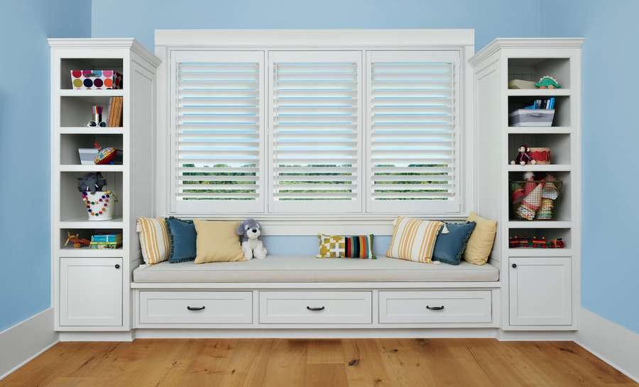 Bedroom window with custom Hunter Douglas Palm Beach Shutters