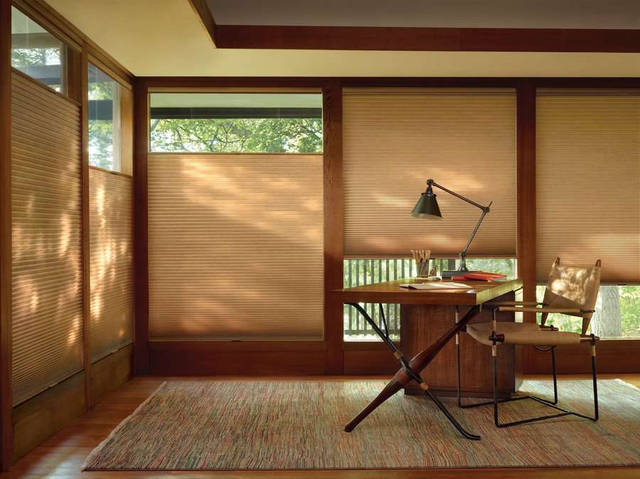 Home office with top to bottom honeycomb shades