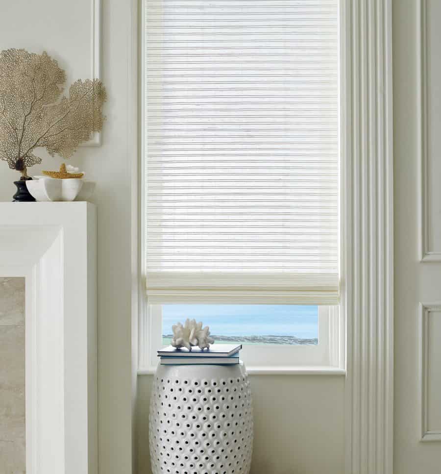 White wood woven shades in a living room