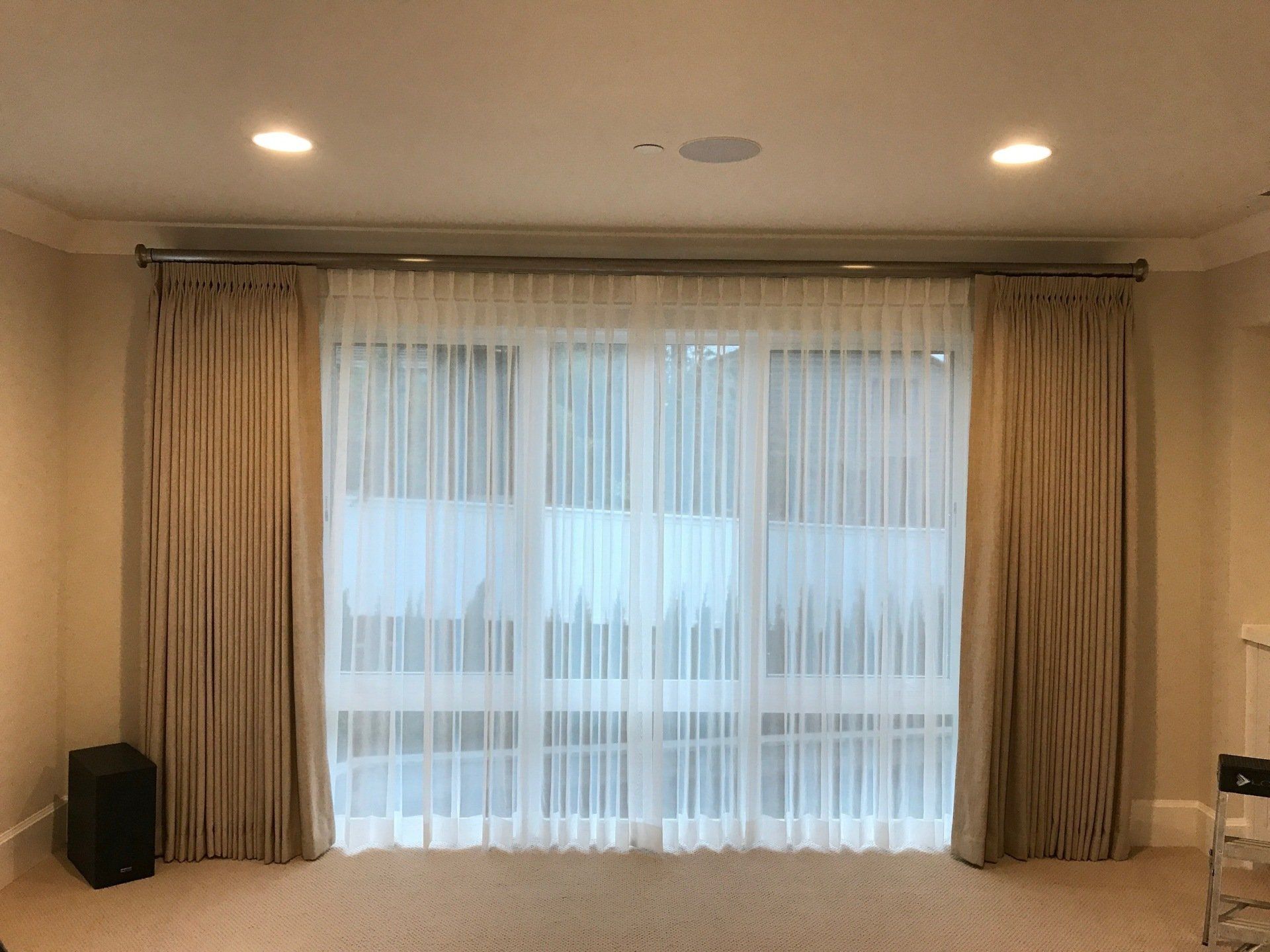 Sliding glass door in Renton, WA with custom shades and drapes