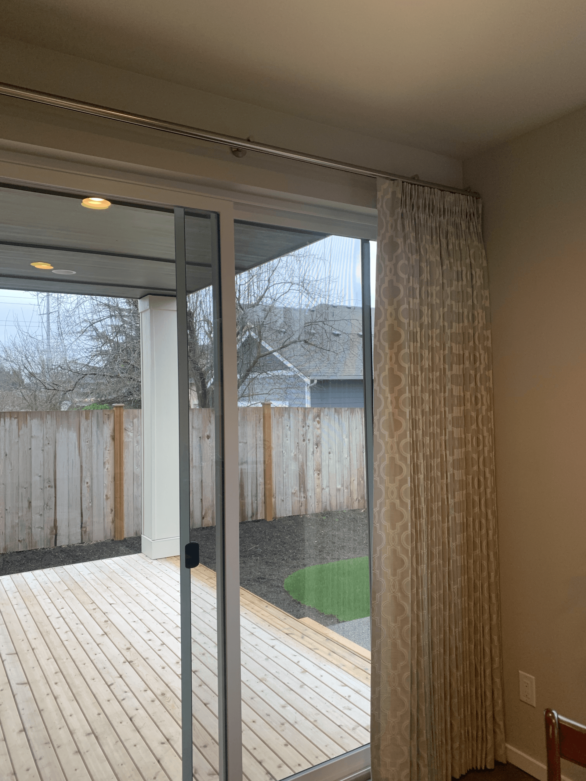 Sliding glass door in Des Moines, WA with custom drapes