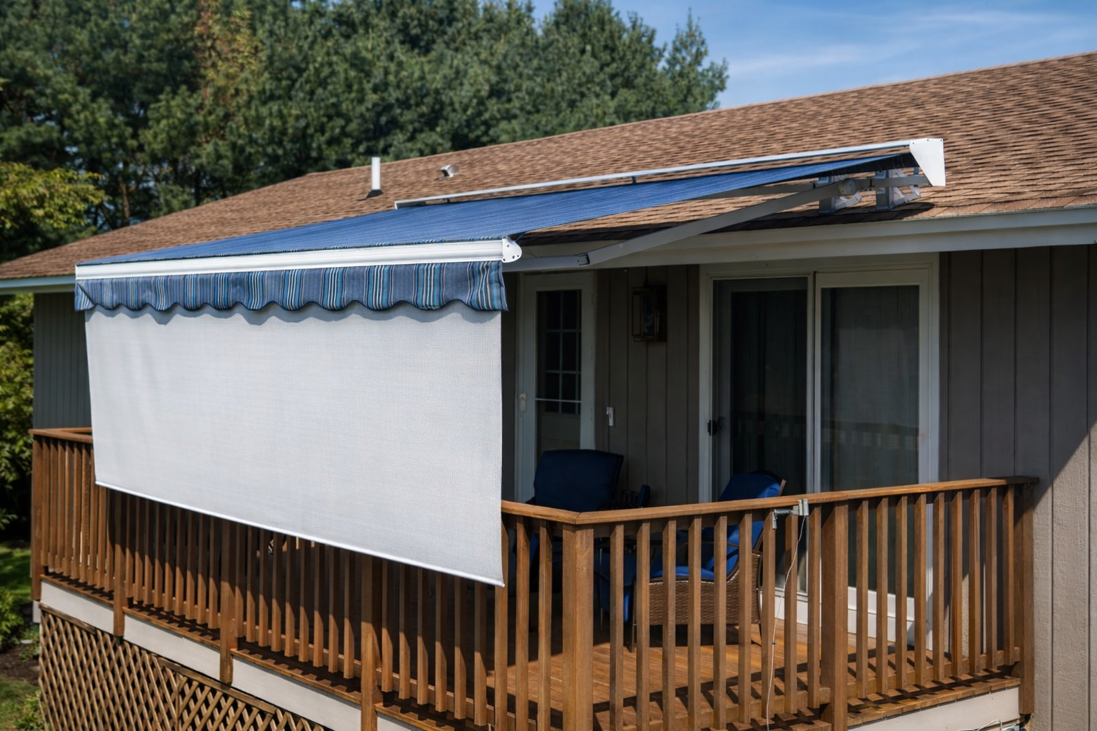Outdoor roller shade system on backyard patio deck designed for Pacific Northwest weather conditions