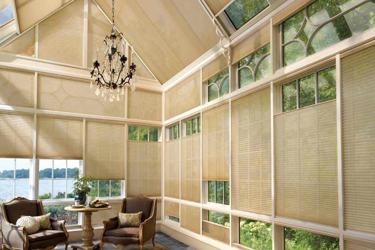 Many Hunter Douglas Duette® Cellular Shades installed on skylights and windows in a modern sunroom near Kent, WA