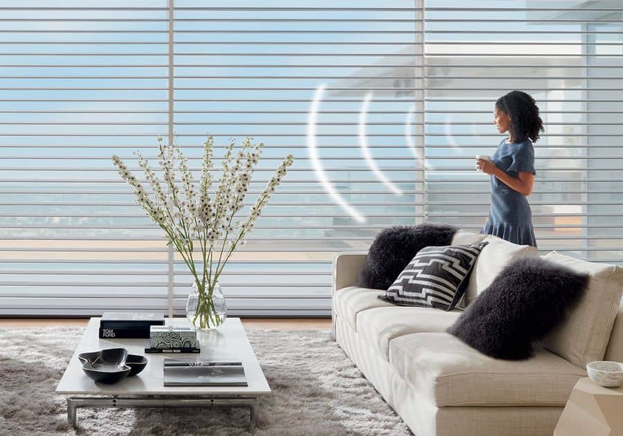 Woman with PowerView® Automation blinds in her Auburn, WA home