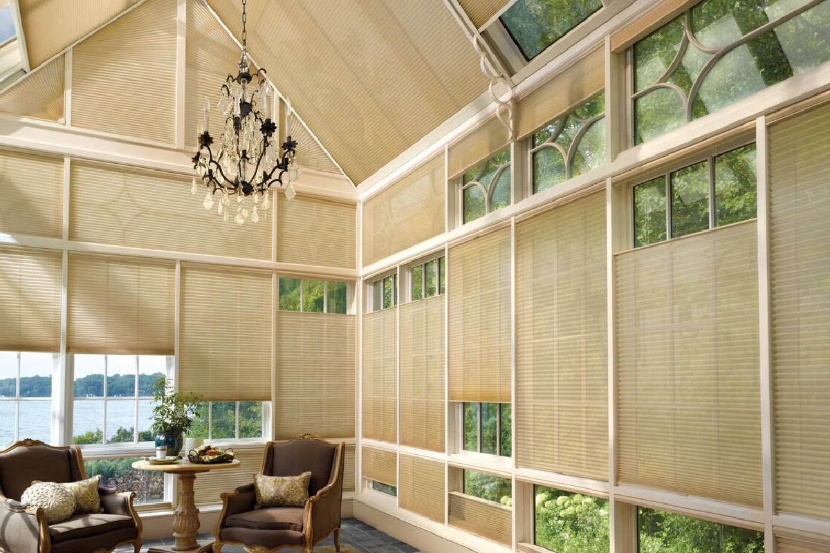 Hunter Douglas Duette® Honeycomb Shades on a skylight and windows in a Kent, WA sunroom