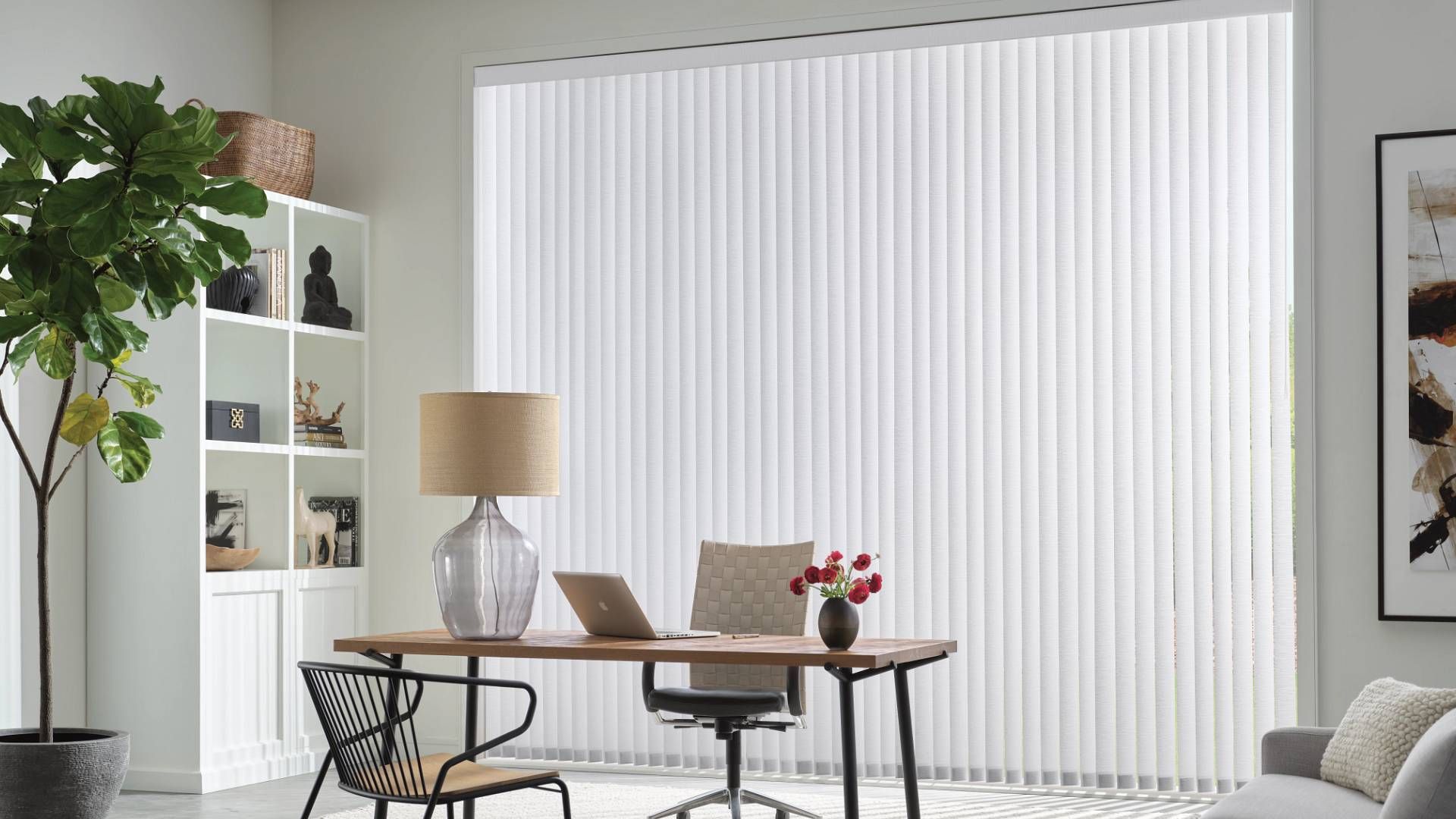 Hunter Douglas Vertical Solutions® Vertical Blinds hanging in the window of  an office space near Ke