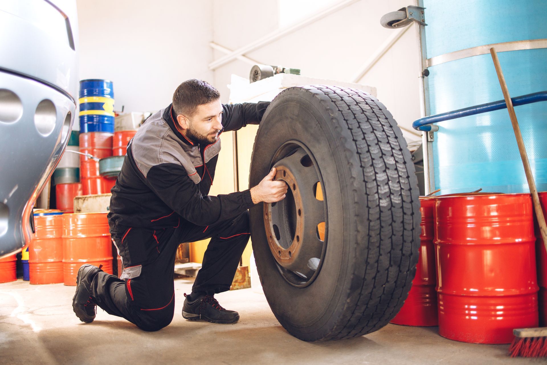 Expert technician performing a new commercial tire installation in Roanoke, VA, ensuring reliability