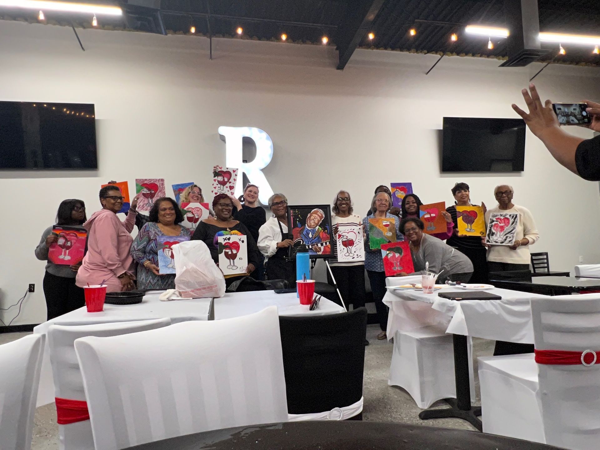 A group of people are posing for a picture in a room.