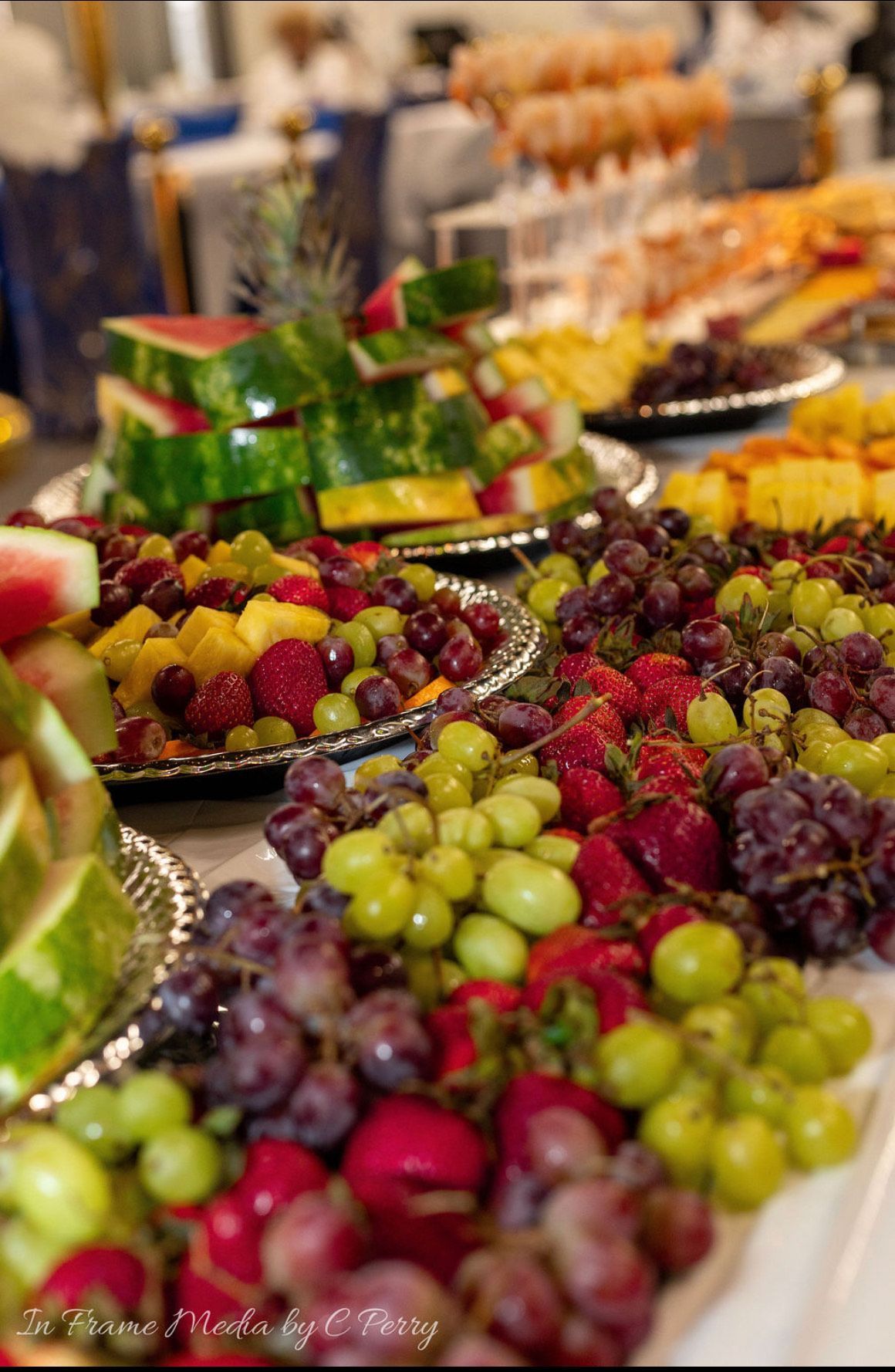 A variety of fruits and vegetables on plates on a table