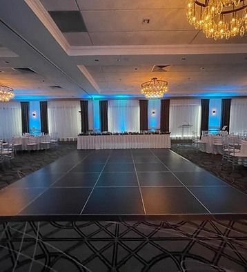 There is a large dance floor in the middle of the room.