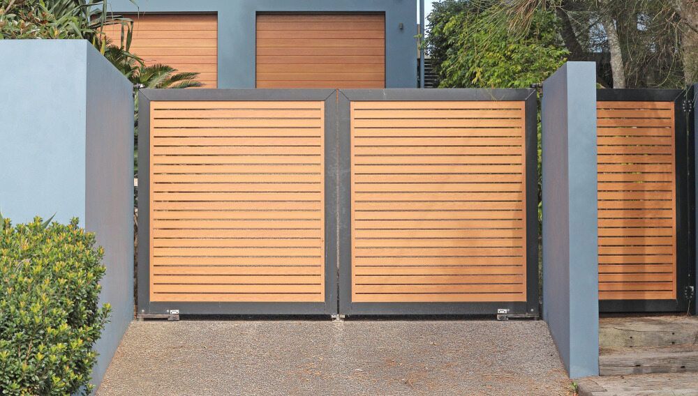 A Wooden Gate is Open in Front of a House — We Do Fencing in Sunshine Acres, QLD