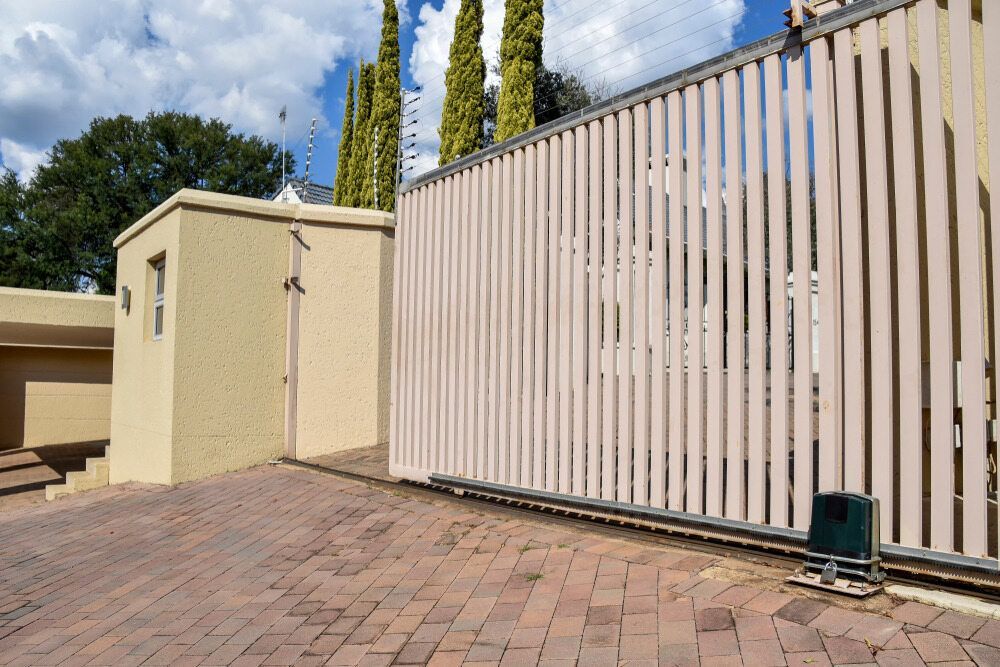There is a Sliding Gate in the Middle of a Driveway — We Do Fencing in Sunshine Acres, QLD