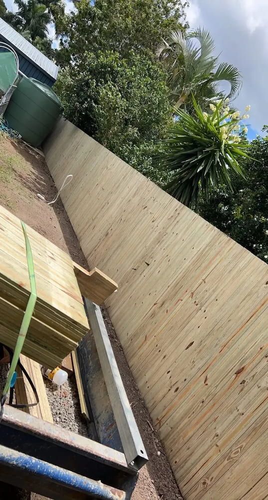 A Wooden Fence is Being Built in a Backyard — We Do Fencing in Sunshine Acres, QLD