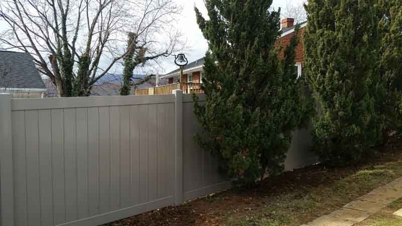 Secured Fence Installation — Trees Beside Fence in Salem, VA