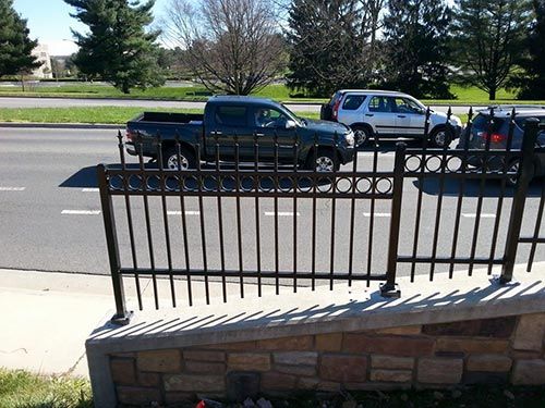 Wrought Iron Fences — Black Gate Beside Street in Salem, VA