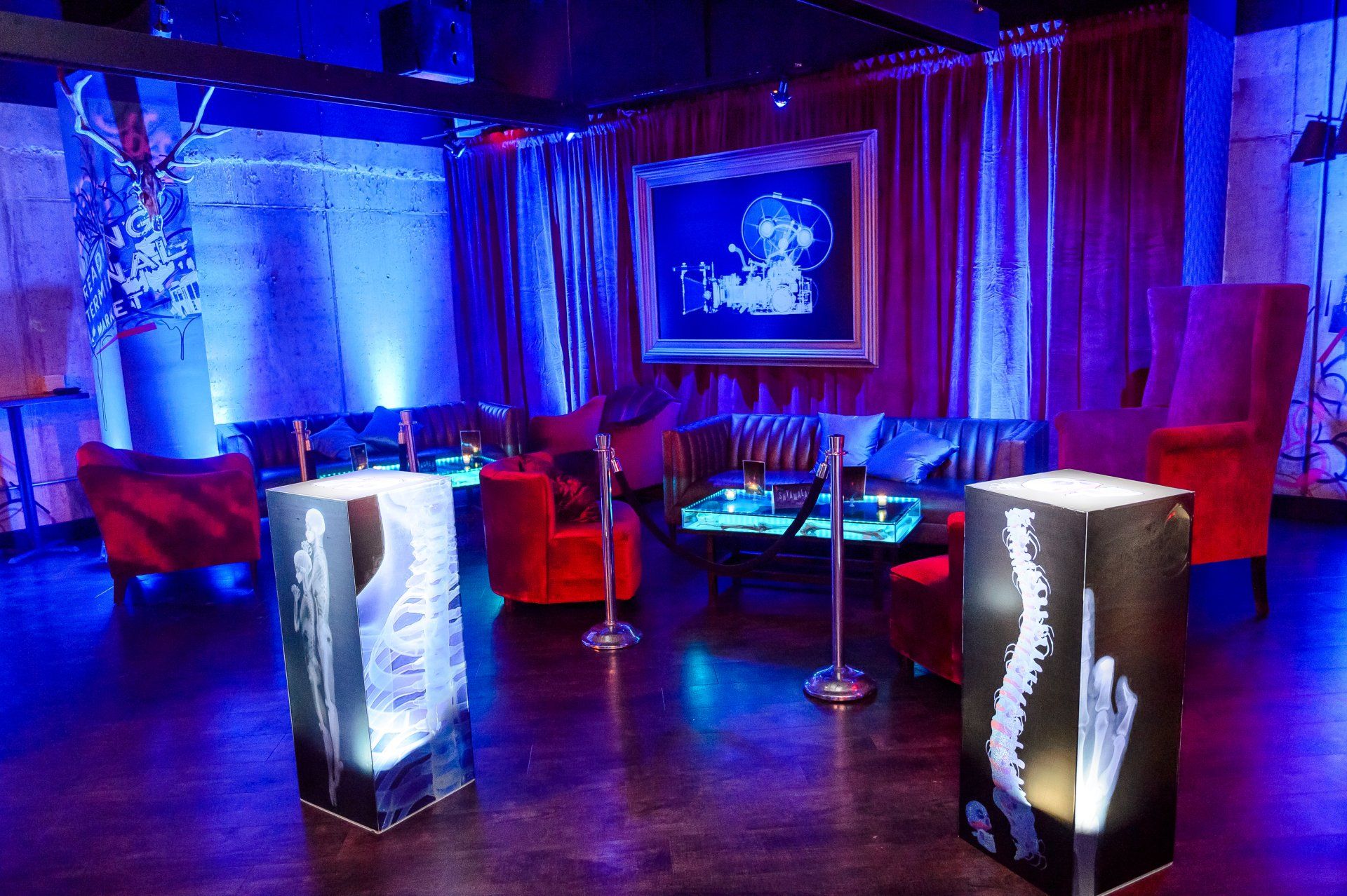 A room with a lot of furniture and blue lights