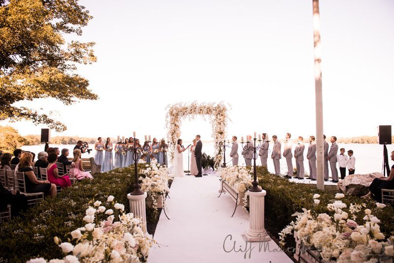 A bride and groom are walking down the aisle at a wedding ceremony.