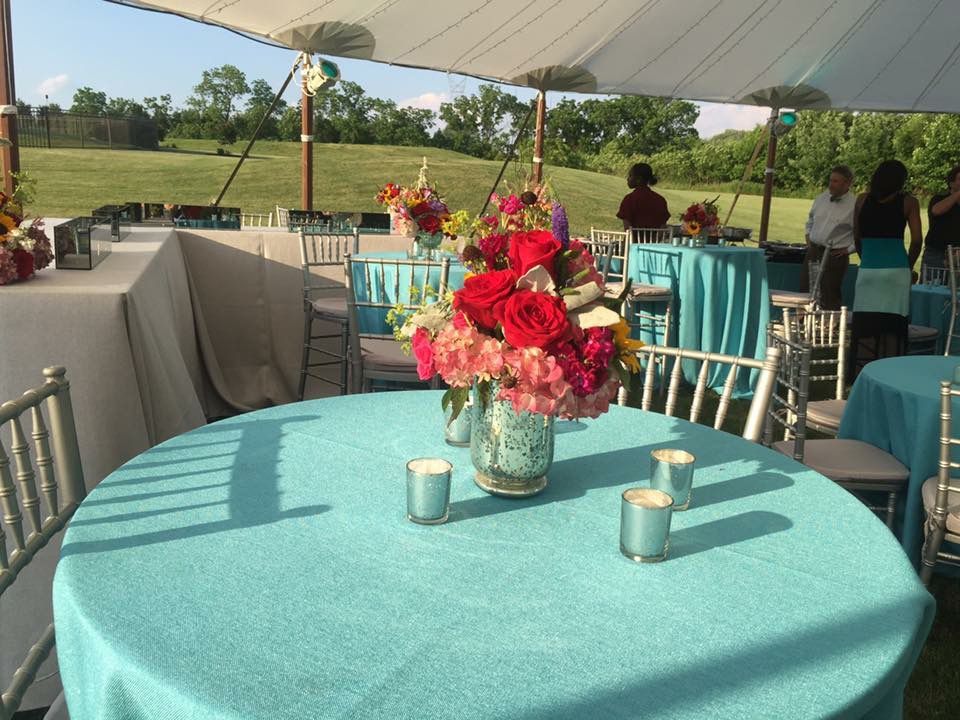 A table with a vase of flowers on it