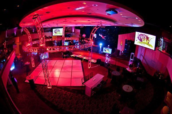 An aerial view of a dance floor with red lights