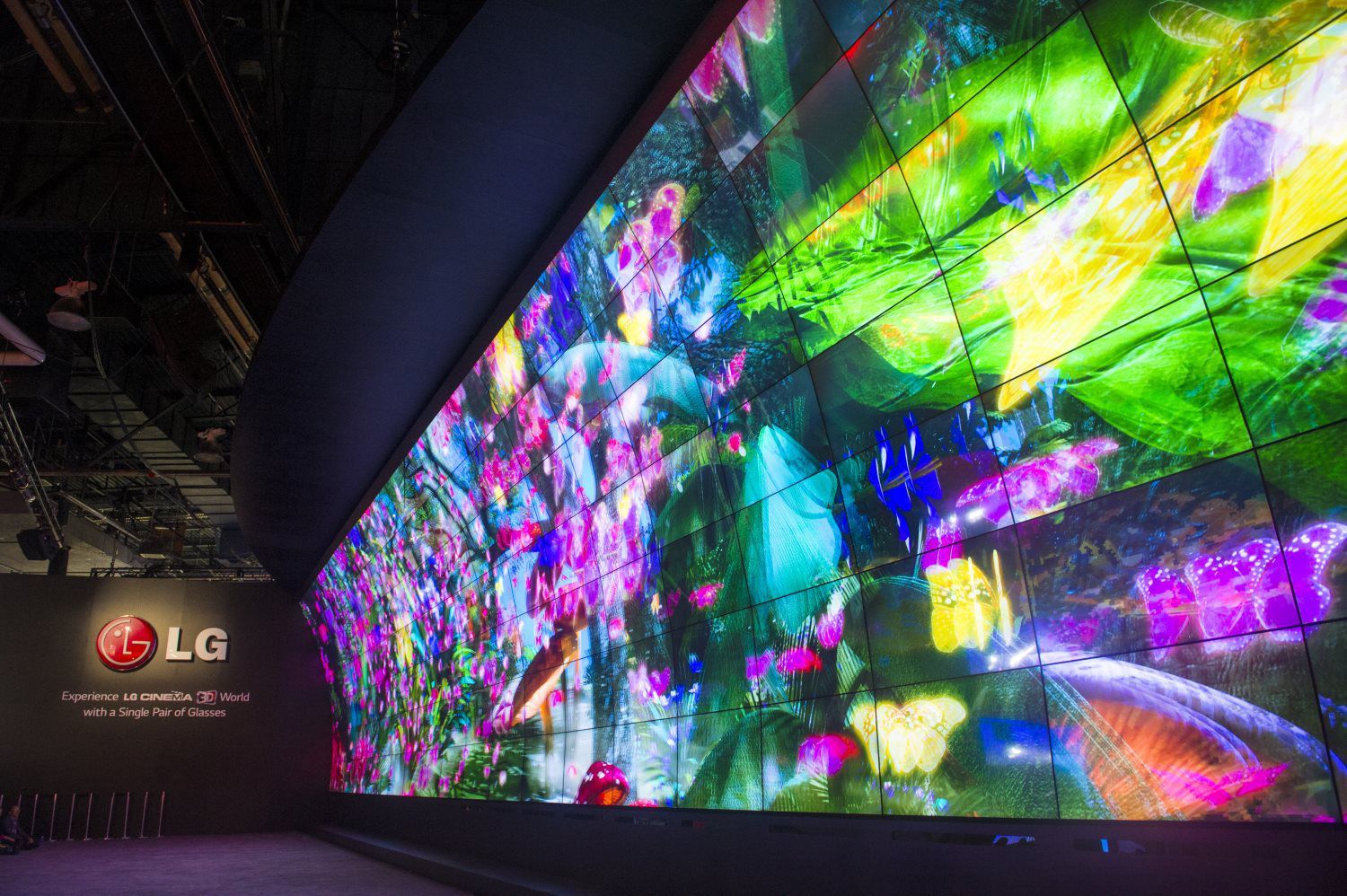 A large screen displaying a colorful painting on it.