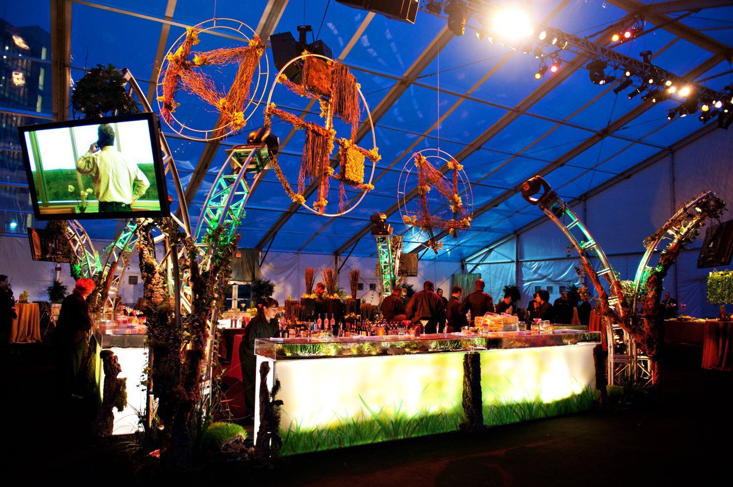 A large tent with a ferris wheel hanging from the ceiling