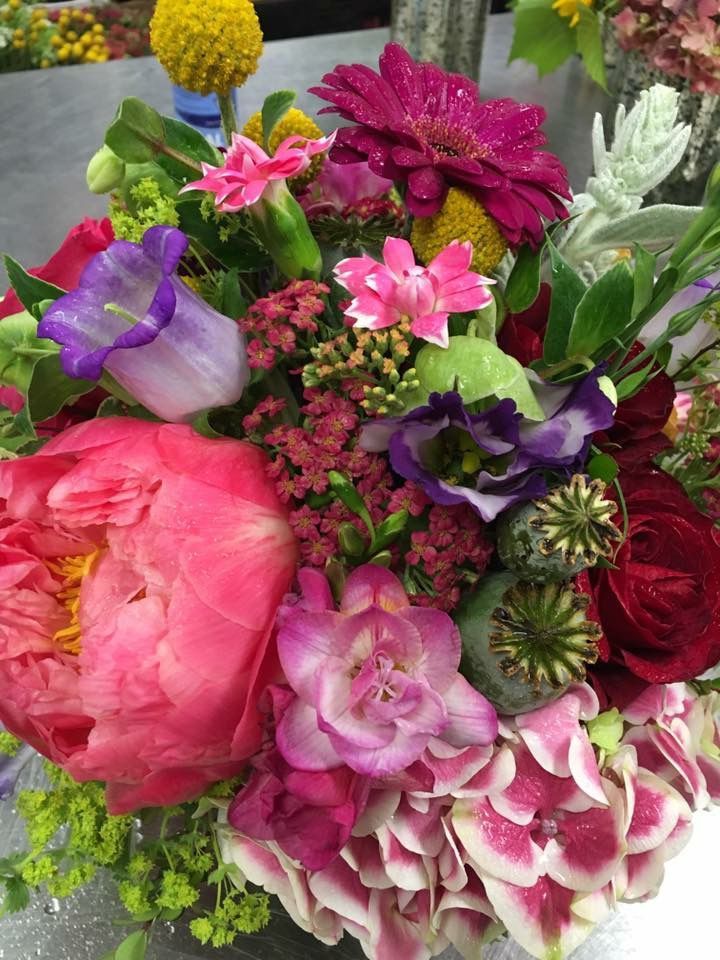 A bouquet of pink and purple flowers on a table