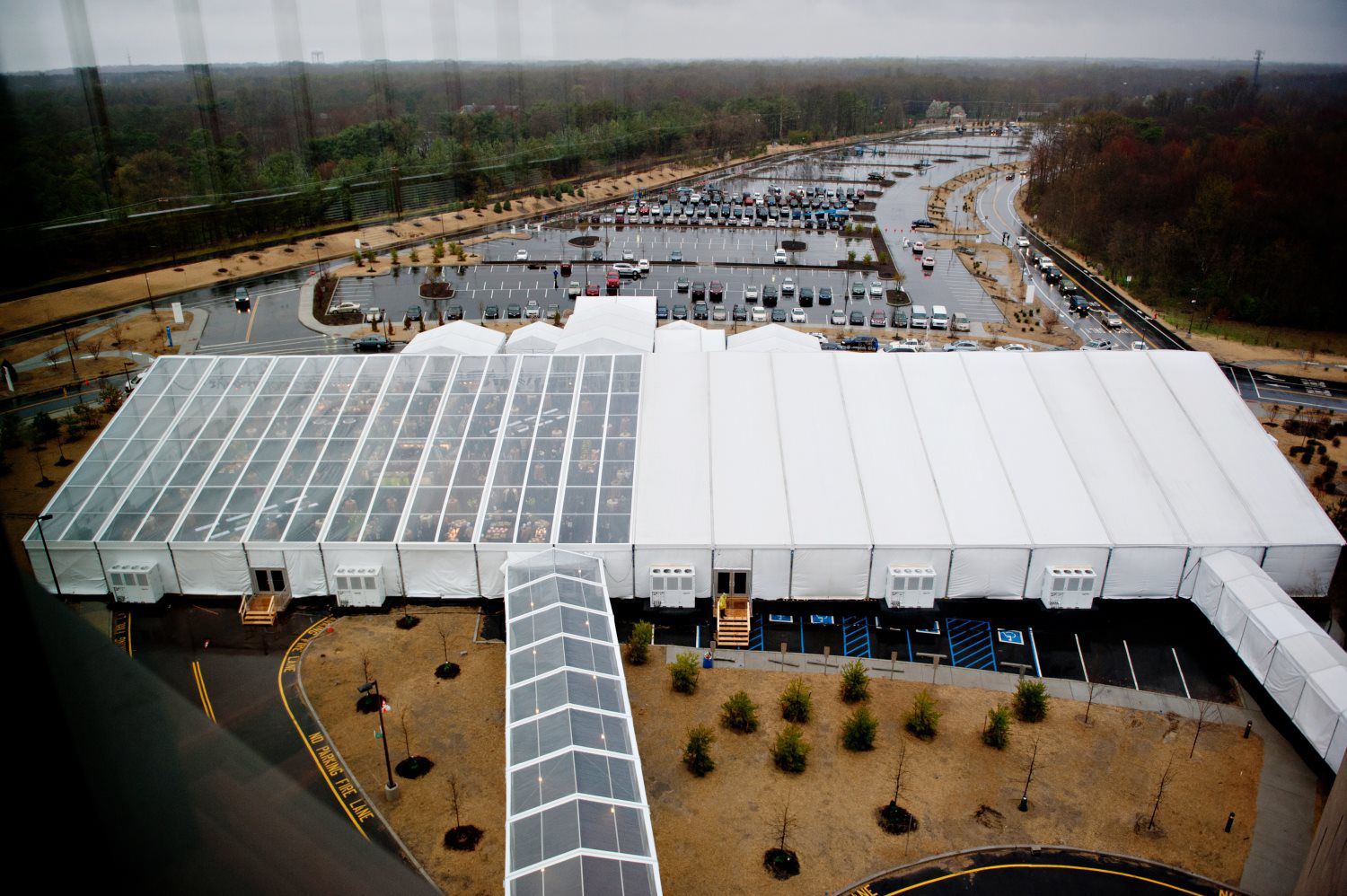 An aerial view of a large building with a clear roof