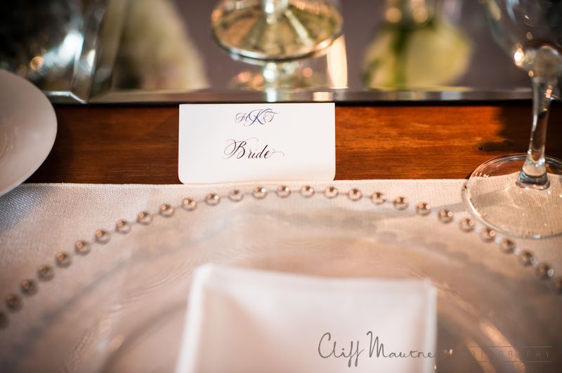 A place setting for a wedding with a name tag on a plate.