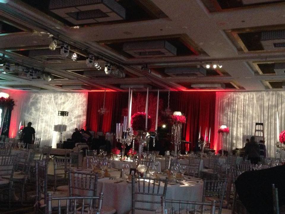 A large room with tables and chairs set up for a party