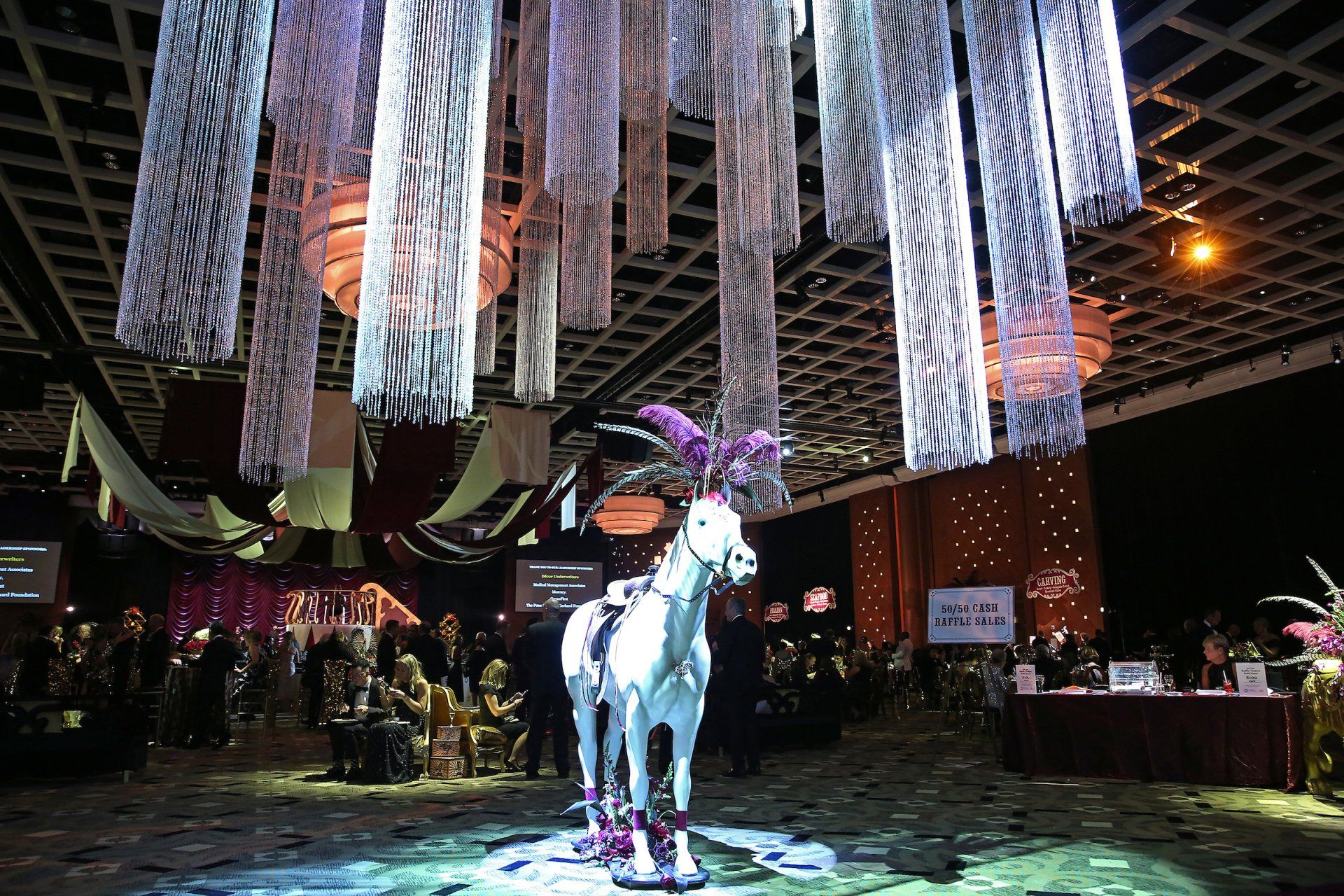 A large room with a statue of a goat in the middle of it