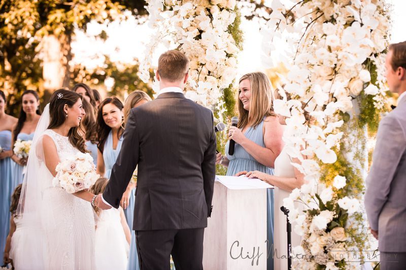 A bride and groom are standing at a podium during their wedding ceremony.