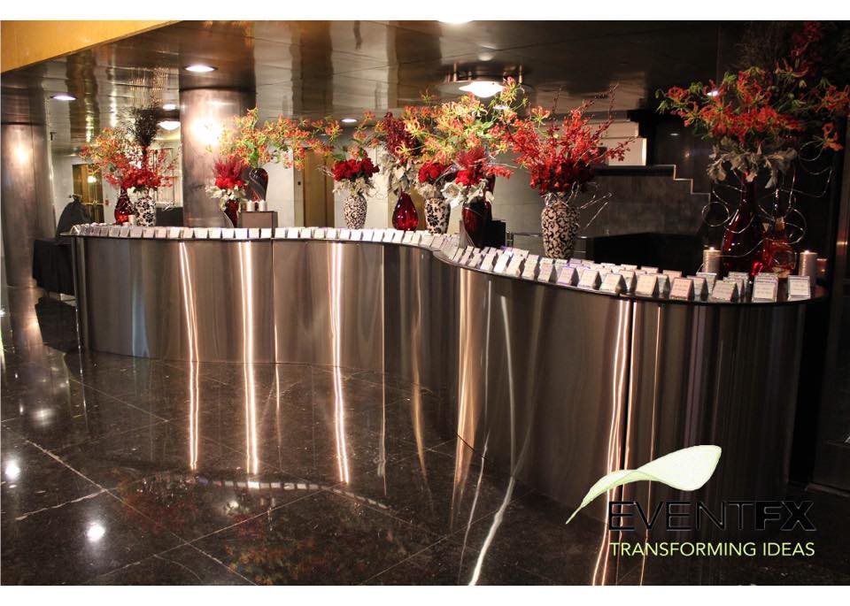 A stainless steel counter with red flowers on it