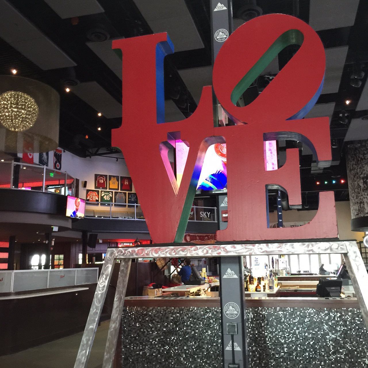 A large red love sign in a restaurant