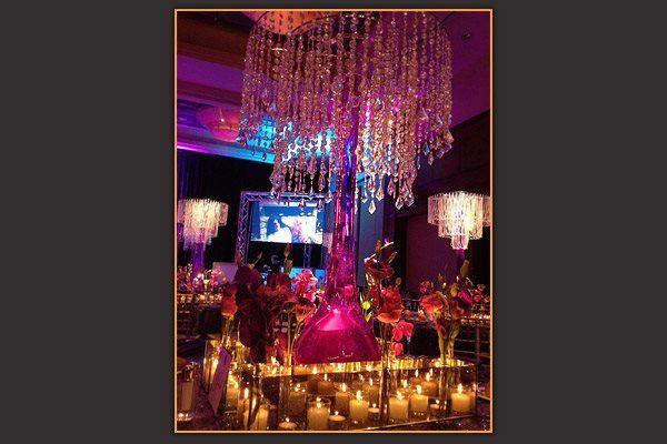 A picture of a room with candles and a chandelier
