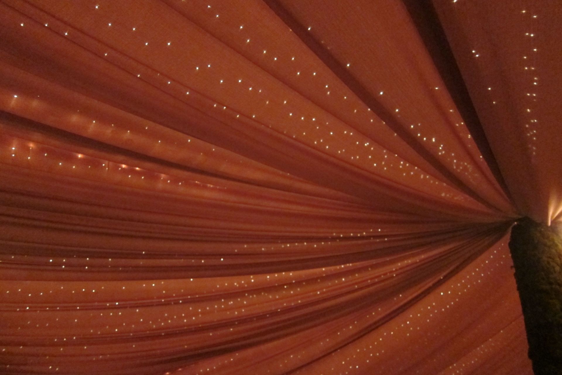 A red curtain with a lot of lights on it