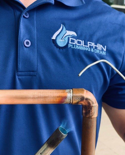 Water Leak — Plumber Repairing A Pipe in Fort Myers, FL