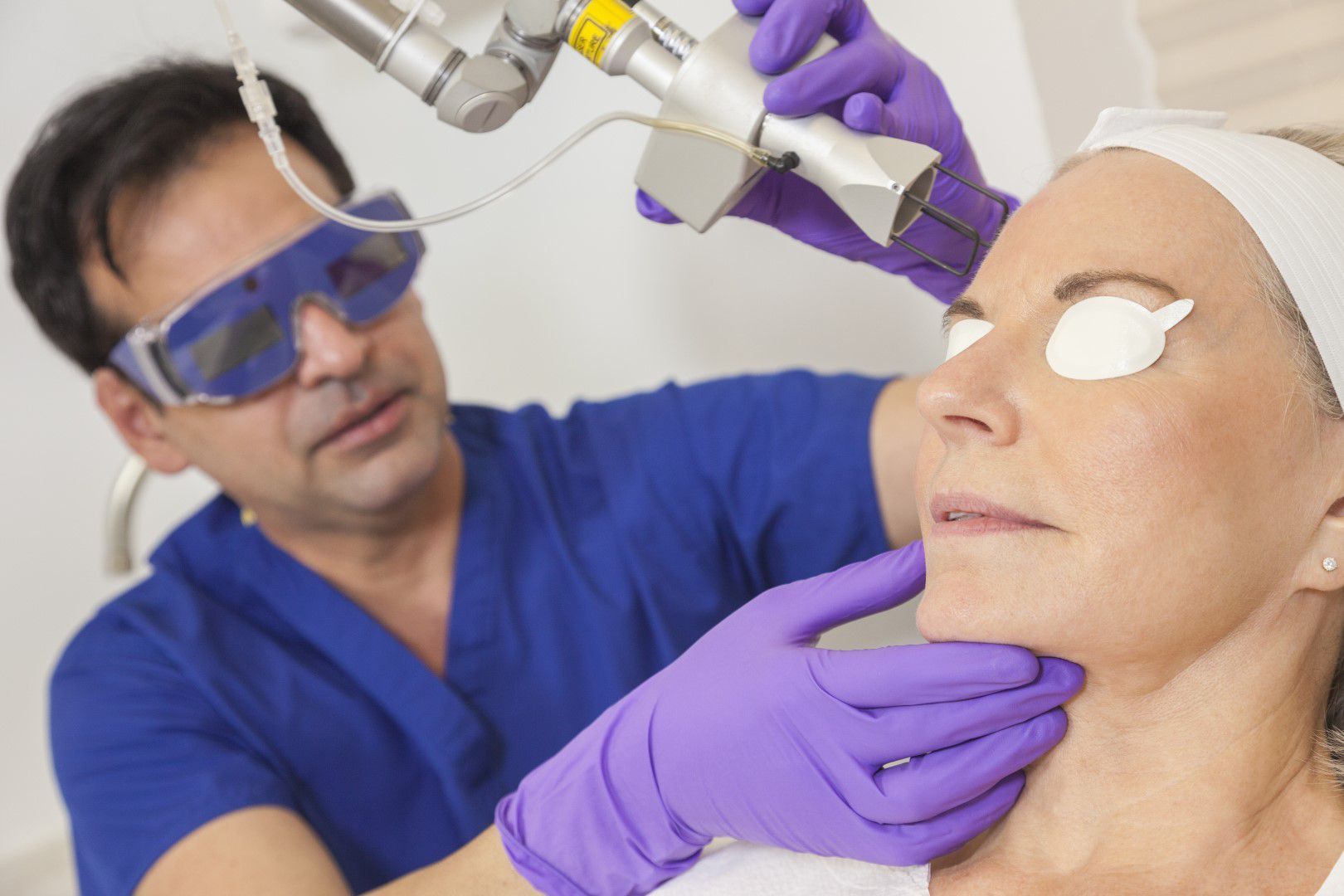 Woman having laser treatment