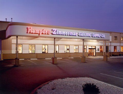 A hampton zimmerman electric supply co building at night