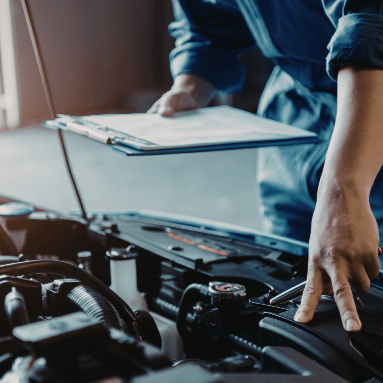 A mechanic doing a pre-purchase inspection