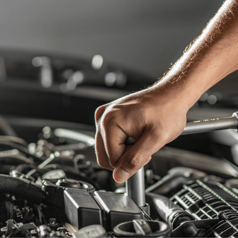 A mechanic doing an on-site vehicle repair